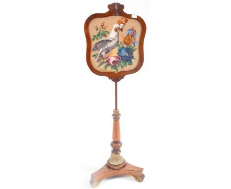 A Victorian 19th century mahogany &amp; brass pole screen. The fire screen having a needlepoint central panel with Cockatoo p