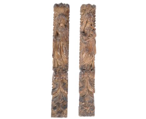A pair of 17th century architectural salvage carved fruitwood pilaster / wall plaques. Both carved into heavy relief and depi