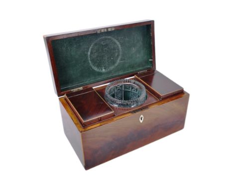 An early 20th century c1910s rectangular mahogany tea caddy with copper handle to lid, opening to reveal cut glass vase centr