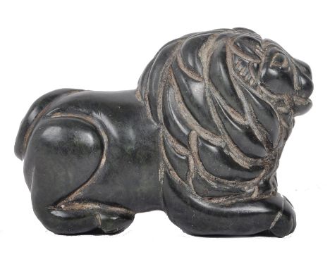 A Qing Dynasty 19th century Chinese Oriental spinach green Jade hand carved figurine amulet in the shape of a seated lion. Be