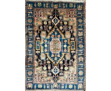 A 19th century North West Persian Islamic Nahawand hand woven floor carpet rug having a central rhombus shaped black, yellow 