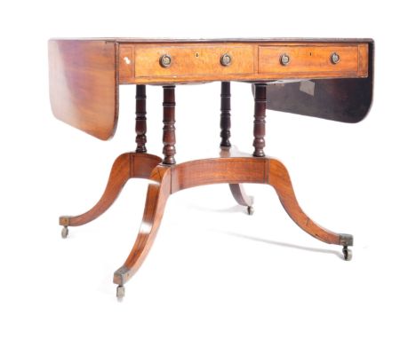 A George III 19th century mahogany sofa drop leaf desk table. The table having short drop leaves with twin drawers to each si