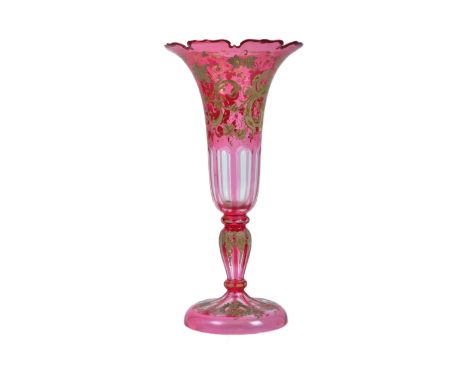 A late nineteenth / early 20th century Bohemian Czech incised cranberry vase, with floral splayed rim, octagonal incised clea