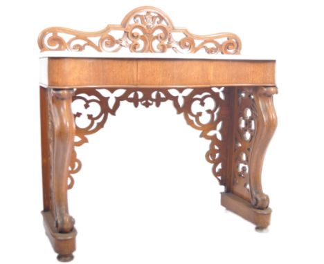 A 19th century Victorian&nbsp; mahogany and marble console hall table. The table having a pierced back gallery back with serp