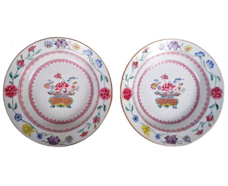 A&nbsp; pair of 18th century Chinese Yongzheng period armorial dishes. Each with hand painted floral stems and sprays to the 