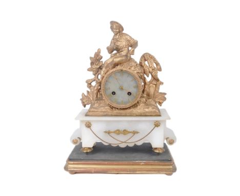 A 19th century French 8 day mantel clock. Set on a gilt wooden bracket, the white marble body having gilt feet and adorned gi