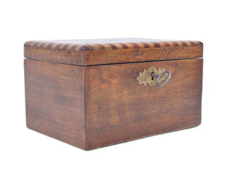 A George III early 19th century mahogany inlaid marquetry tea caddy box. The box having a hinged lid with star shaped inlaid 