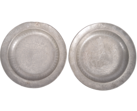 A pair of 18th century Dutch engraved pewter plates of circular form. Etched decoration depicting old master type scenes with