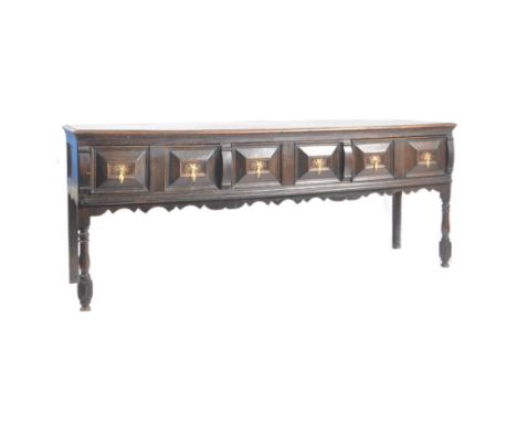 An 18th century circa late 1700's George III oak North Country dresser base - sideboard.&nbsp; The dresser base having a seri