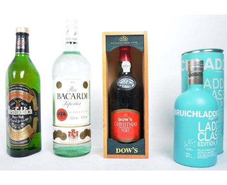 Four bottle assortment of Scottish, Portuguese &amp; Cuban bottled spirits. The lot to include a Bruichladdich Laddie Classic
