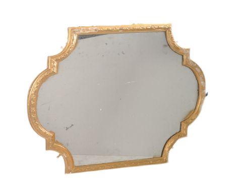 A 19th century gilt wood and gesso worked over mantel / wall mirror. The mirror&nbsp; having shaped cartouche panel design gi
