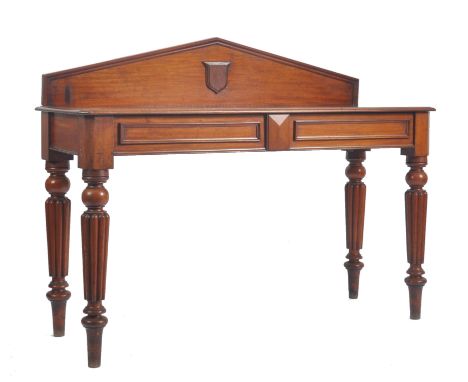 A William IV 19th century mahogany gallery back console hall table. The table having a pediment shaped gallery back with cent