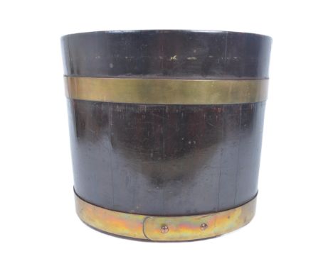 A late 19th century Victorian West Country coopered mahogany brass bound bucket planter. The planter being stamped to base fo