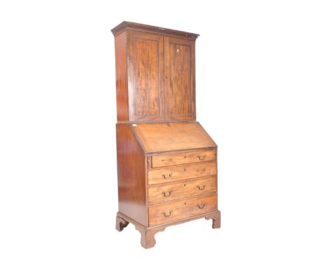 A 19th century George III mahogany estate bookcase bureau. The bureau with twin fielded panel doors with shelved interior, fl