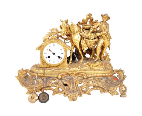 A 19th century French ormolu gilt metal mantel clock having an detailed moulded gilt figure of countryman with horse and bird