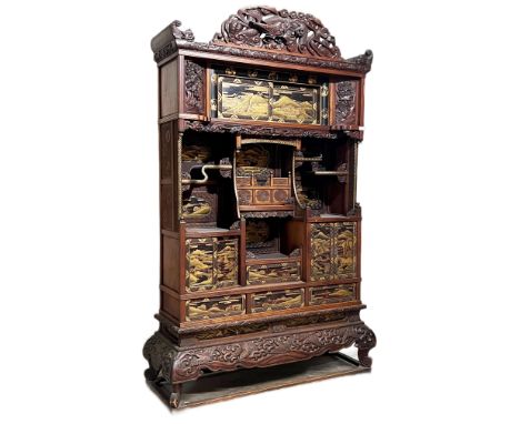 A late 19th Century Japanese Meiji period black lacquer chinoiserie &amp; inlaid display cabinet. The cabinet with carved fre