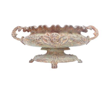 A 19th century Victorian grand tour cast iron campana urn planter. Rococo form being raised on hoof feet with ornamental cast