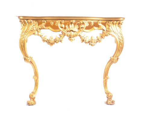 An early 20th century Louis XV style gilt wood &amp; marble top hall console table. The table having a serpentine stepped mar