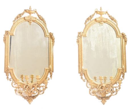 A pair of 19th century large gilt wood and gesso worked girandole wall mirrors. Each mirror adorned with 4 branch acanthus ca