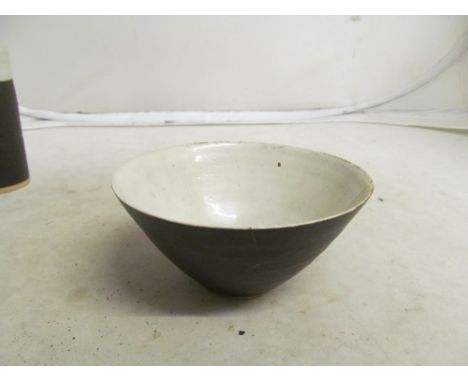 A Lucie Rie bowl, brown glazed exterior and white glazed interior, mark to base (section repaired)