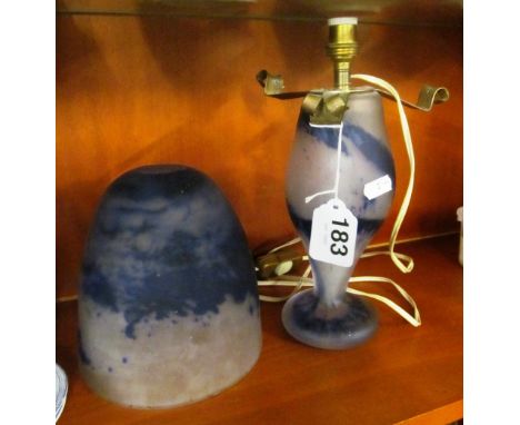 A blue glass table lamp and shade