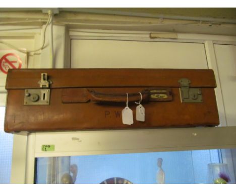 A leather suitcase and lamp shade