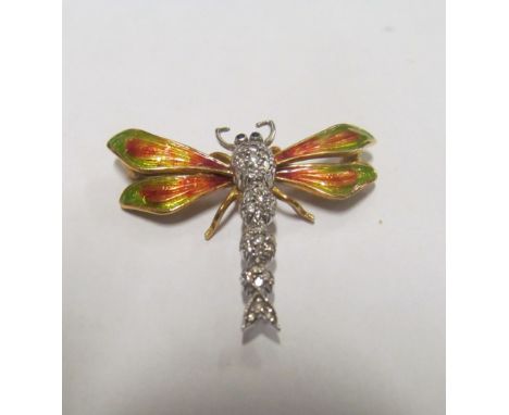 A dragonfly with enamel wings and diamond body marked 750