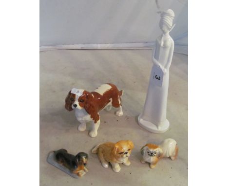 A Spode Victoria figure, Beswick spaniel and three other dogs