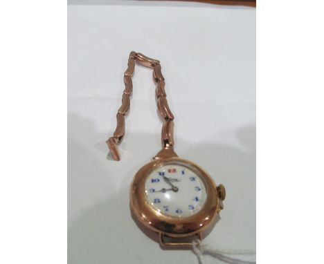 A ladies watch with white enamel dial