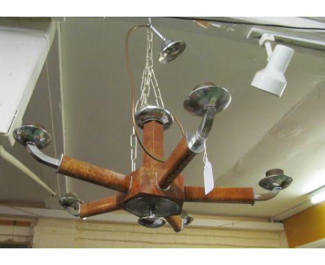 An Art Deco walnut effect and chrome five branch ceiling light with yellow circular shades