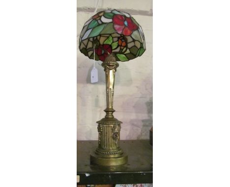 A classical design brass table lamp with Tiffany style shade