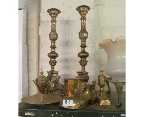 A pair of tall brass candlesticks, other brass and a light shade