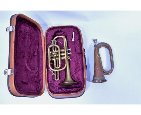 A CASED LAFLEUR BRASS CORNET Serial No 658000 ( brass is tarnished one valve doesnt return and spit valve doesnt close) along