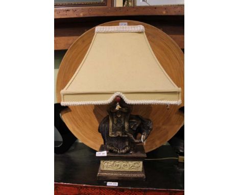 AN ORIENTAL DESIGN TABLE LAMP FORMED AS A MODEL ELEPHANT 
