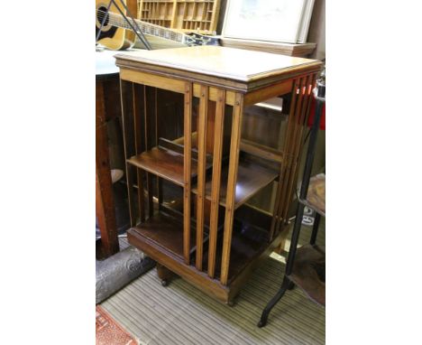 A FIRST QUARTER 20TH CENTURY MAHOGANY FINISHED SMALL SIZED REVOLVING BOOKCASE of typical form &amp; construction, having the 