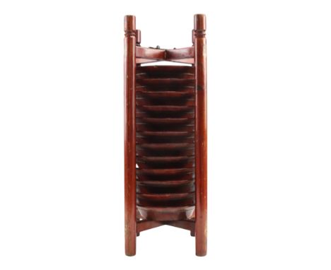 An early 20th Century Chinese iron-mounted wooden plate caddy containing twelve plates, the underside of each plate bearing a