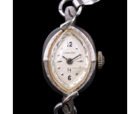 A vintage lady's Hamilton 14 K precious white metal wristlet watch, having an electroplate bracelet strap, circa 1950s-1960s.