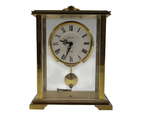 A 1990s "Mr & Mrs" television game show prize brass four-glass "carriage" clock, 15 cm excluding handle.[ "Mr & Mrs" was a Br