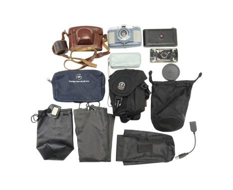 A group of vintage film cameras comprising a Houghtons Ensign Ensignette, a Kodak Vest Pocket Hawk-Eye, a Minolta 16 Model P 