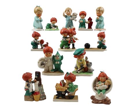 A group of Goebel Hummel figurines, together with two 1980 figurine calendars and Charlot Byj, "An unauthorized guide, Goebel