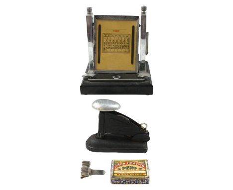A 1930s Art Deco chromium electroplate mounted Bakelite perpetual desk calendar together with a Rexel Universal stapler, a ca