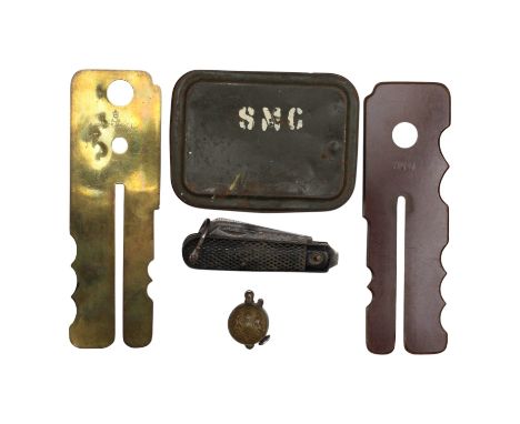 Two British Military button sticks, a "trench art" cigarette lighter, a 1943 clasp knife and a post-War SMG gun cleaning kit