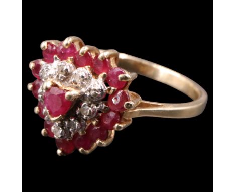 A romantic ruby, diamond and 14 ct yellow metal cluster ring, the central heart-shaped ruby claw-set within concentric circui