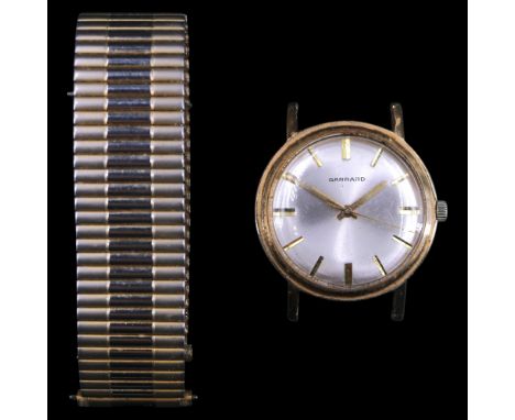 A 1963 Garrard 9 ct gold wristwatch, having a Swiss 17-jewel manual-wind movement and circular radially-brushed face with gil