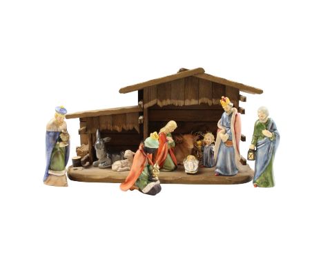 Ten Goebel Hummel Nativity figurines together with stable, latter length 43 cm