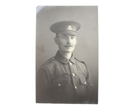 A Great War photographic portrait postcard of a private of the 11th (Lonsdale) Battalion, Border Regiment