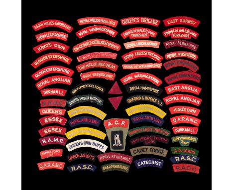 A large quantity of British Army shoulder titles, including North Irish Horse, Royal Army Ordnance Corps and Cadet Force