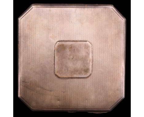 A George V silver powder compact of canted-square form with wavy linear engine-turned decoration, Birmingham, 1913, 135 g 