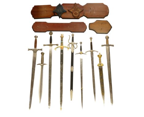 A group of nine replica swords, including swords from Lord of The Rings, together with seven wall-mounting display plaques 