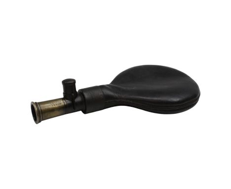 A Victorian brass and leather shot flask having a Sykes Patent nozzle, 18 x 9 cm. [ flintlock / percussion / shotgun / musket